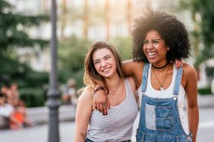 Teen girls embracing